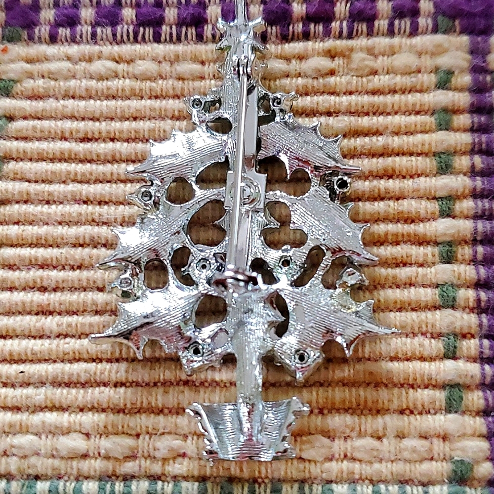 Pretty oliday broach with red/gold bow, green Holly leaves and gorgeous pearls.